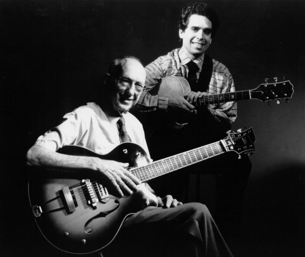George Van Eps and Howard Alden playing their 7-string acoustic guitars 