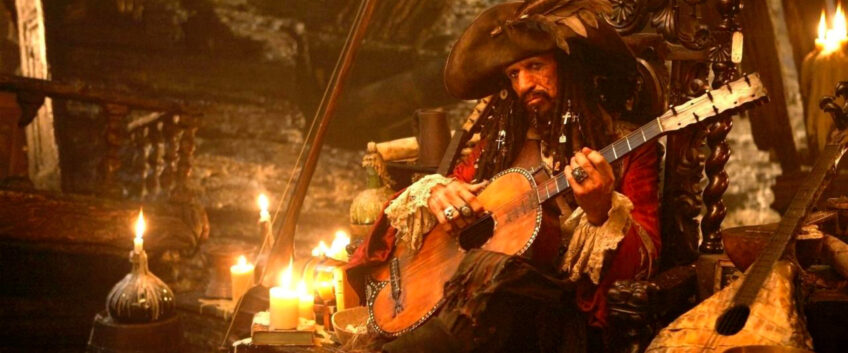 Pirate playing guitar in 'Pirates of the Caribbean' movie scene