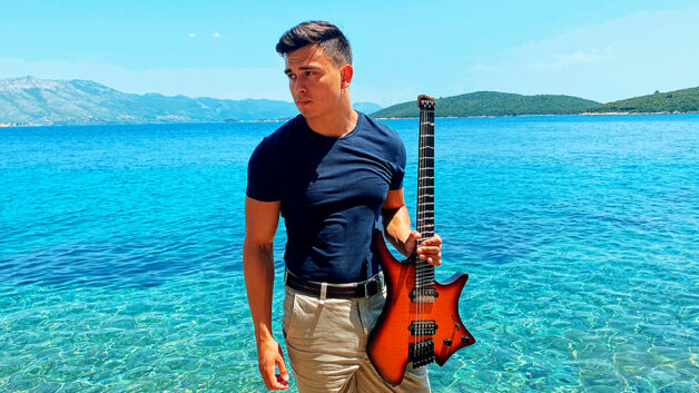 Eric Assarsson with his Strandberg guitar